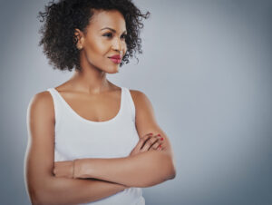 Confident woman staring off into the abyss | Featured image for cosmetic surgery and self esteem blog.