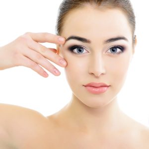 Close up of a womans face. | Featured image for Benefits of Eyelid Surgery - Blepharoplasty Benefits blog.