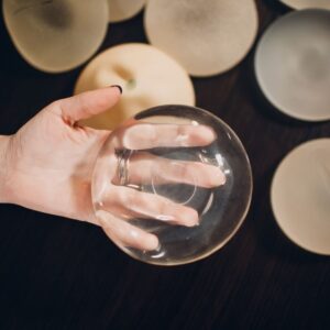 Photo of a variety of breast implants | Featured image for types of breast implants blog.